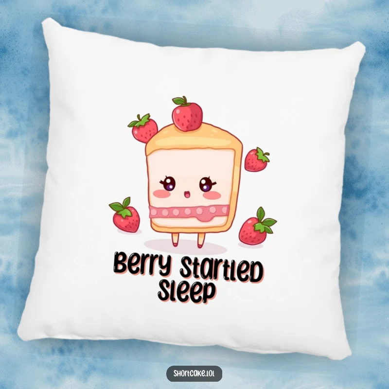 Funny pillow featuring a shortcake slice character with a surprised expression, as a berry falls nearby.