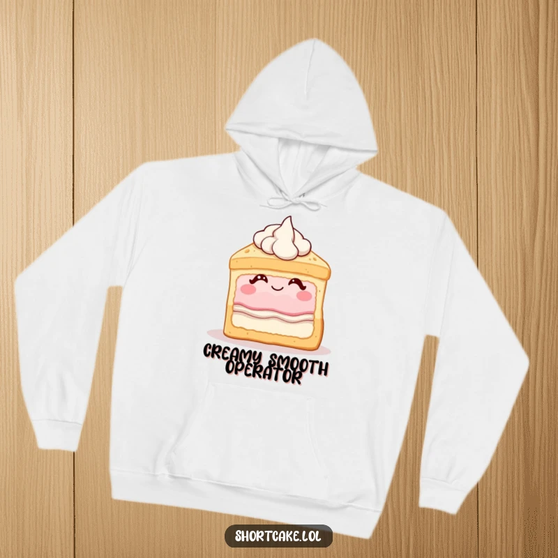 Funny shortcake hoodie showing a dessert slice winking with cream, a humorous and cozy item for dessert lovers.