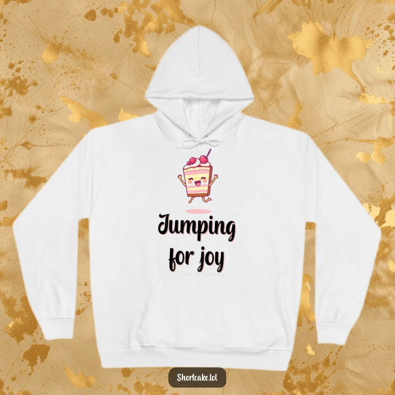 Funny Shortcake Slice Hoodie showing a character leaping joyfully, perfect for cozying up with a sweet and humorous vibe.