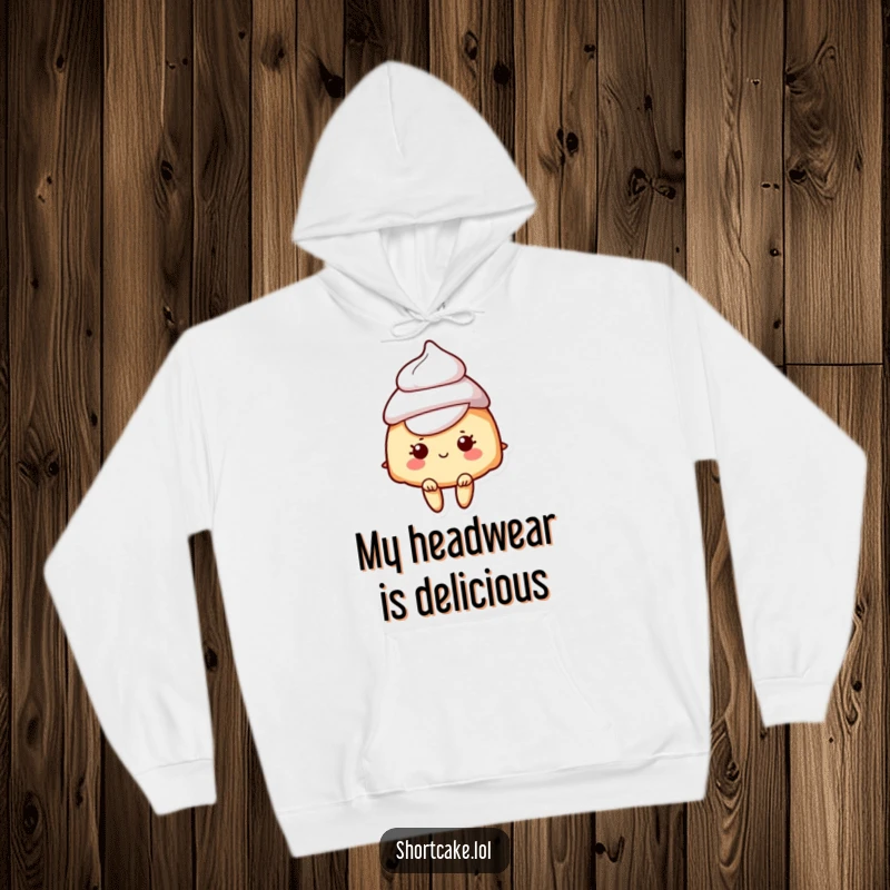 Funny hoodie featuring a shortcake character wearing a fluffy cream hat, radiating whimsical dessert vibes.