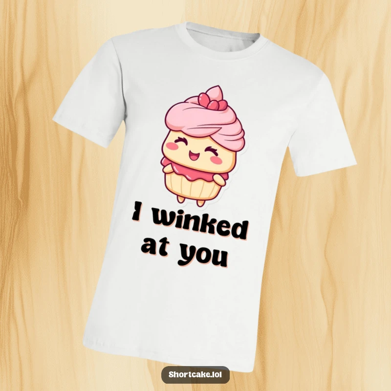 Funny t-shirt depicting a shortcake character delivering a charming and playful wink, ideal for dessert lovers with a sense of humor.